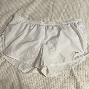 White Nike athletic shorts.